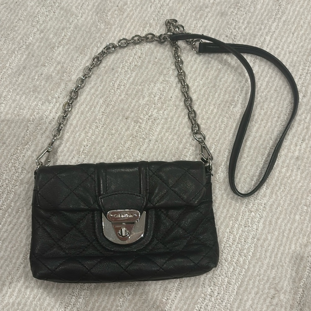 Calvin Klein cross body purse. Black quilted. 8-1/2” X 5”
